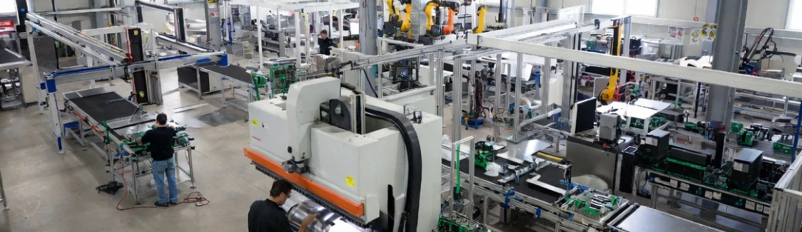 Vertically integrated manufacturing facility showing sheet metal fabrication and electronics integration for custom self-service terminal projects and interactive kiosk configurations